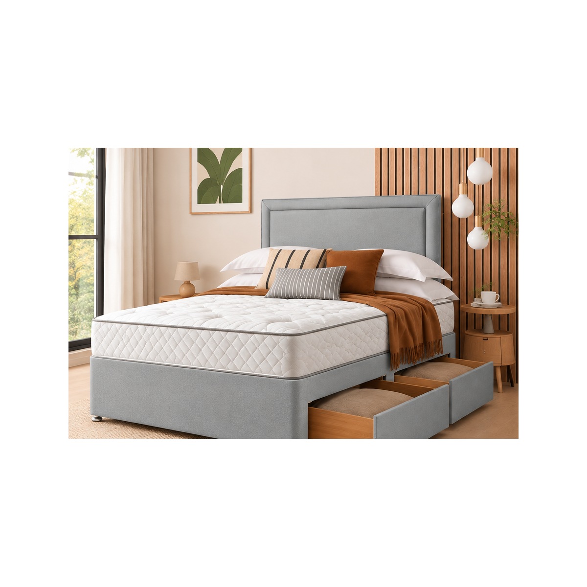 Classic light grey divan bed with two storage drawers and matching padded headboard in a styled bedroom